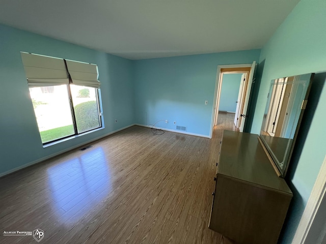 13939 Harrington Dr, Warren, MI 48088 - empty room with wood finished floors and baseboards