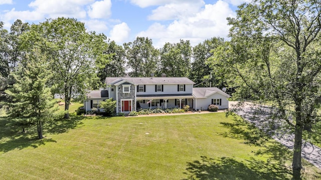 2905 E Munger Rd, Tecumseh, MI 49286 - view of front of property with a front yard, covered porch, and a chimney