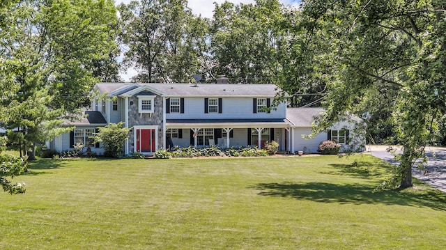 2905 E Munger Rd, Tecumseh, MI 49286 - colonial home with a front yard, a chimney, and covered porch