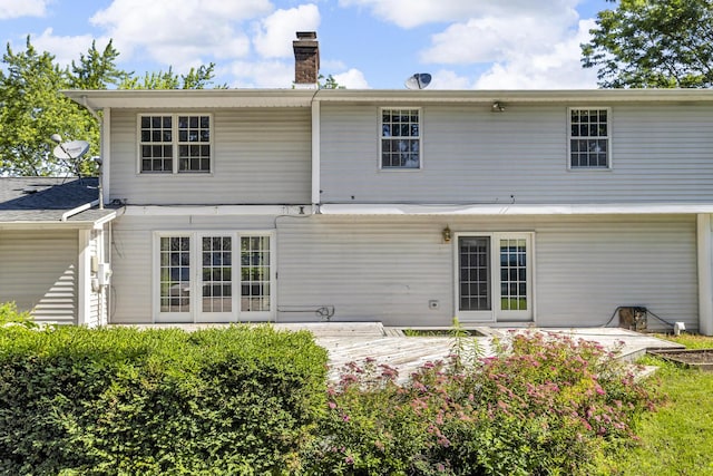 2905 E Munger Rd, Tecumseh, MI 49286 - back of house featuring a chimney and a deck