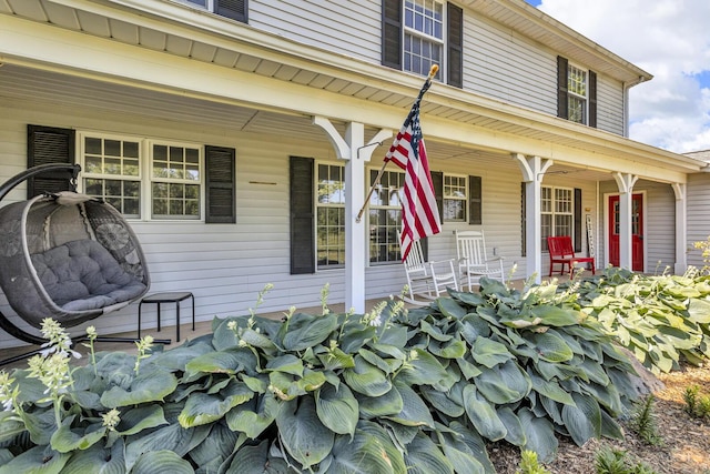 2905 E Munger Rd, Tecumseh, MI 49286 - view of exterior entry featuring a porch