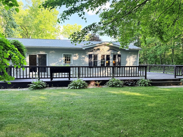 11585 190th Ave, Big Rapids, MI 49307 - back of property with a wooden deck and a yard