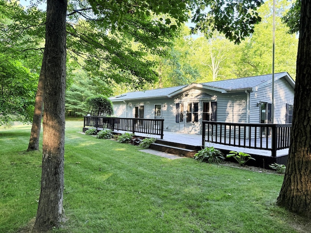 11585 190th Ave, Big Rapids, MI 49307 - view of front of home featuring a deck and a front yard