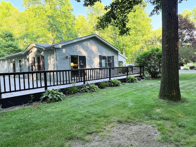11585 190th Ave, Big Rapids, MI 49307 - view of home's exterior with a deck and a yard