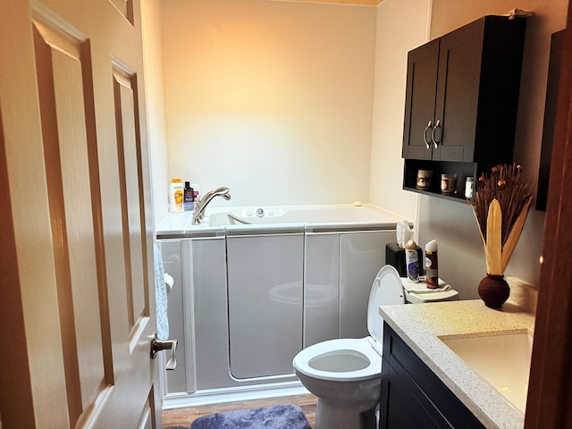 11585 190th Ave, Big Rapids, MI 49307 - full bathroom with vanity, a bath, and wood finished floors