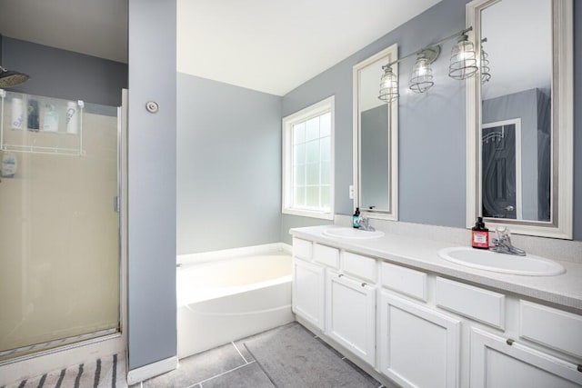 507 Illinois Dr, Tecumseh, MI 49286 - full bath featuring a garden tub, double vanity, a shower stall, and tile patterned flooring