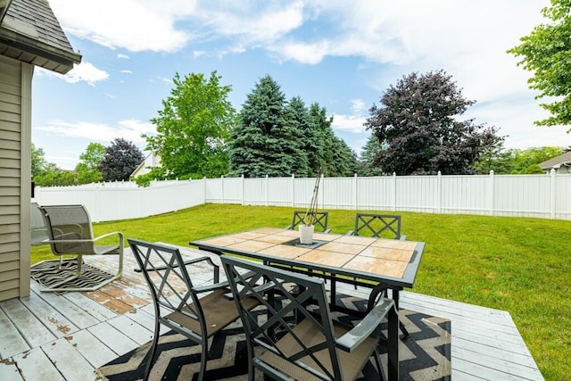 507 Illinois Dr, Tecumseh, MI 49286 - wooden deck with a fenced backyard and outdoor dining area