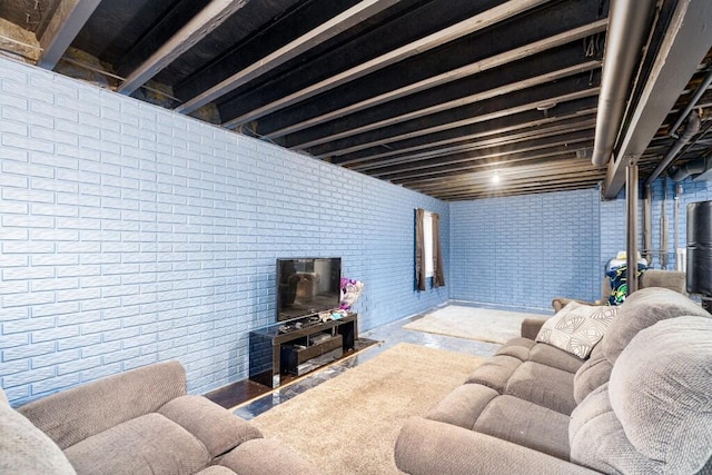 507 Illinois Dr, Tecumseh, MI 49286 - living room featuring brick wall and a wood stove