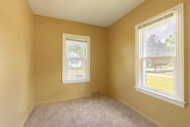 1234 Diamond Ave NE, Grand Rapids, MI 49505 - spare room featuring carpet flooring and baseboards
