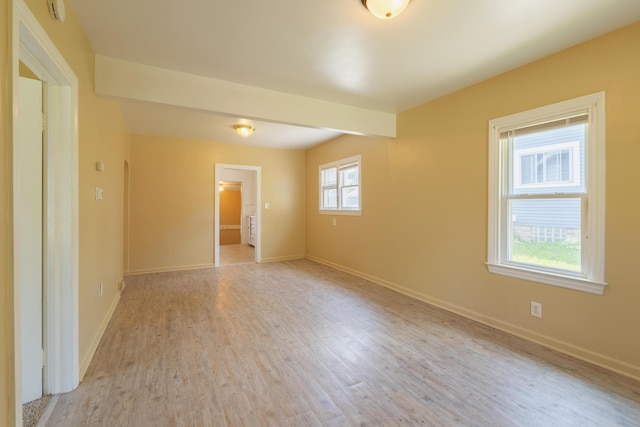 1234 Diamond Ave NE, Grand Rapids, MI 49505 - unfurnished room featuring light wood finished floors and a smoke detector
