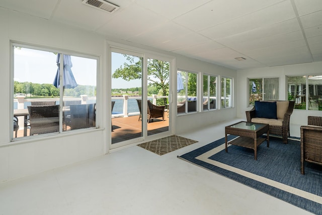 5680 Woodland Ave, Watervliet, MI 49098 - sunroom featuring concrete flooring and a paneled ceiling