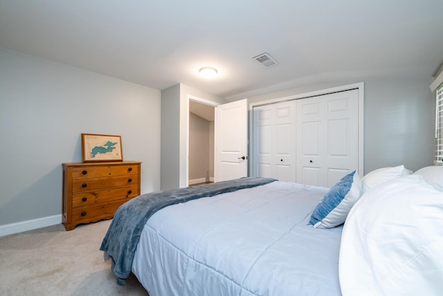 5680 Woodland Ave, Watervliet, MI 49098 - bedroom featuring light carpet, a closet, and vaulted ceiling