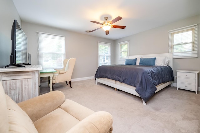 5680 Woodland Ave, Watervliet, MI 49098 - bedroom with light carpet, a ceiling fan, and a desk
