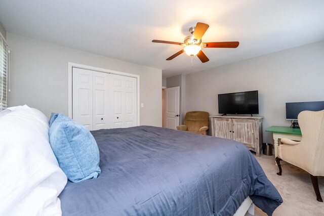 5680 Woodland Ave, Watervliet, MI 49098 - bedroom featuring light colored carpet, ceiling fan, and a closet