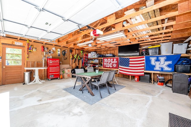 5680 Woodland Ave, Watervliet, MI 49098 - garage featuring a workshop area and a garage door opener
