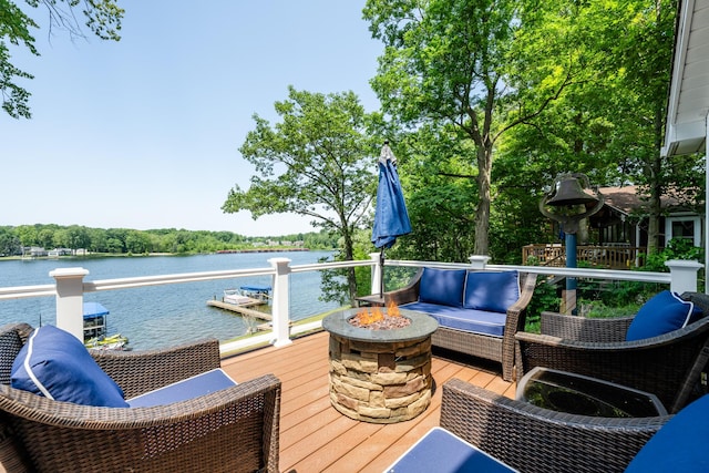 5680 Woodland Ave, Watervliet, MI 49098 - wooden terrace featuring a fire pit and a water view