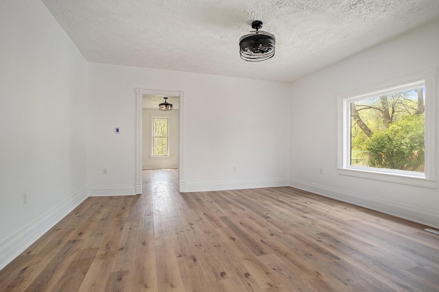 22121 Bedford Rd N, Battle Creek, MI 49017 - spare room featuring light wood finished floors and a textured ceiling