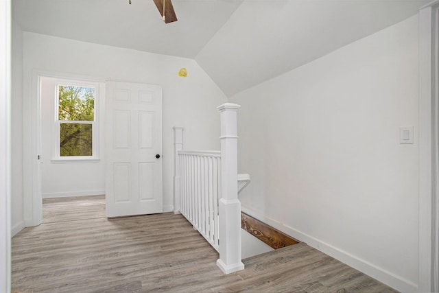 22121 Bedford Rd N, Battle Creek, MI 49017 - corridor with an upstairs landing, wood finished floors, and lofted ceiling