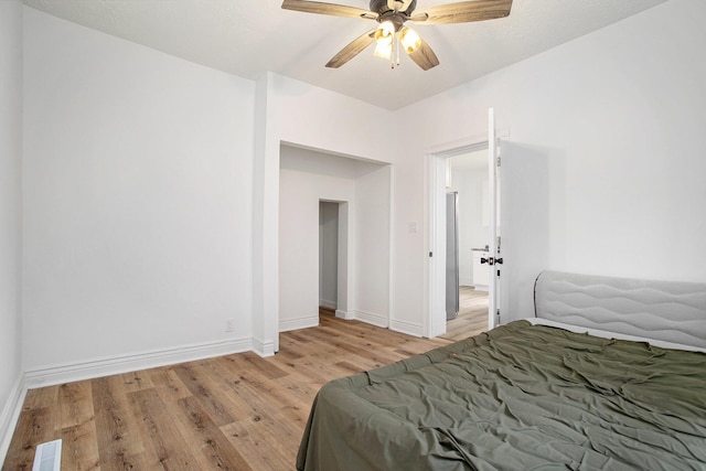 22121 Bedford Rd N, Battle Creek, MI 49017 - bedroom featuring light wood-style flooring and a ceiling fan
