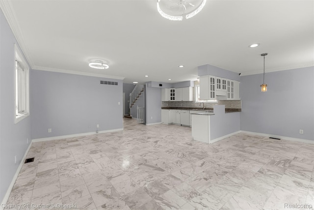 7115 Steadman St, Dearborn, MI 48126 - unfurnished living room with crown molding, stairs, and recessed lighting