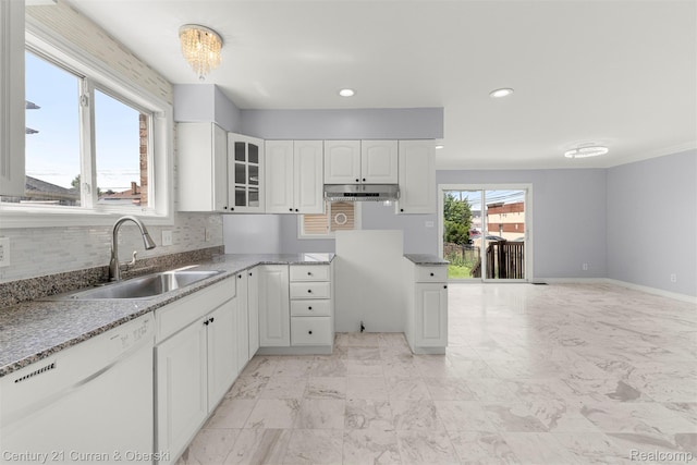 7115 Steadman St, Dearborn, MI 48126 - kitchen featuring white dishwasher, under cabinet range hood, glass insert cabinets, white cabinets, and tasteful backsplash