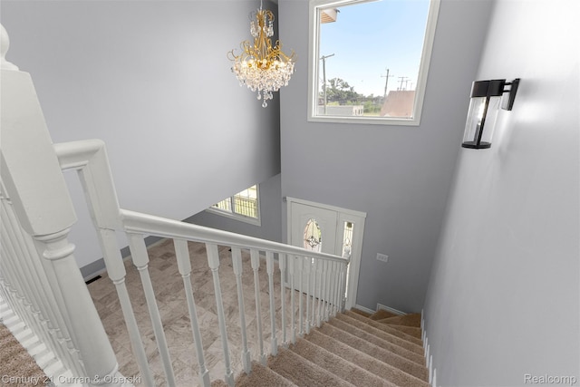 7115 Steadman St, Dearborn, MI 48126 - stairs with healthy amount of natural light, a chandelier, and a high ceiling