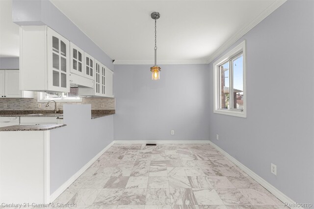 7115 Steadman St, Dearborn, MI 48126 - unfurnished dining area featuring ornamental molding and light marble finish floors