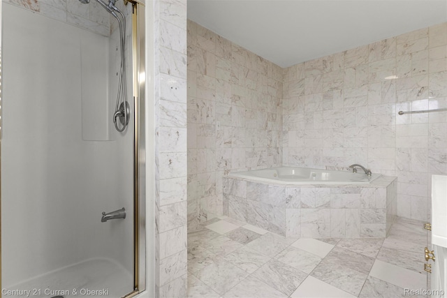 7115 Steadman St, Dearborn, MI 48126 - bathroom featuring a shower stall, a garden tub, and tile walls