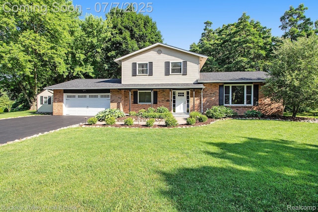 1049 Hillcrest Ave, Brighton, MI 48116 - split level home featuring a garage, driveway, a front yard, brick siding, and a shingled roof