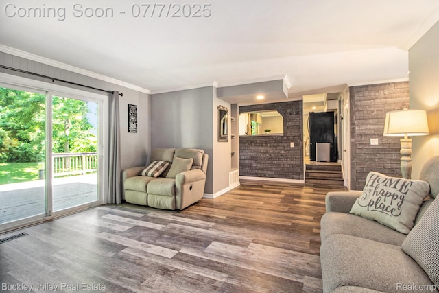 1049 Hillcrest Ave, Brighton, MI 48116 - living area with wood finished floors, crown molding, and brick wall