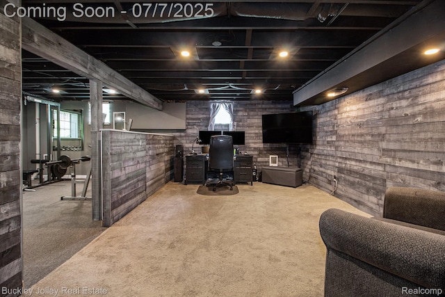 1049 Hillcrest Ave, Brighton, MI 48116 - below grade area with healthy amount of natural light, a desk, wooden walls, and carpet flooring
