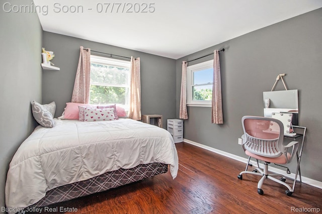 1049 Hillcrest Ave, Brighton, MI 48116 - bedroom featuring multiple windows and wood finished floors