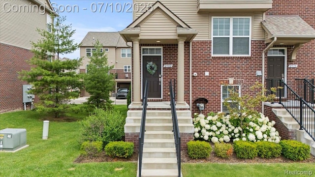 2582 Helmsdale Cir, Rochester, MI 48307 - view of front of property featuring brick siding and a front lawn
