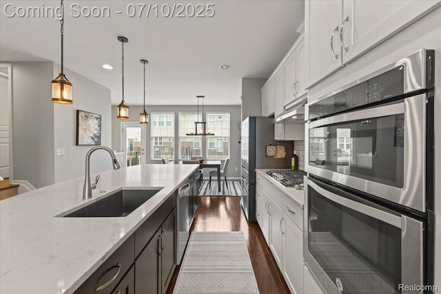 2582 Helmsdale Cir, Rochester, MI 48307 - kitchen with appliances with stainless steel finishes, dark wood-type flooring, white cabinets, pendant lighting, and light stone counters