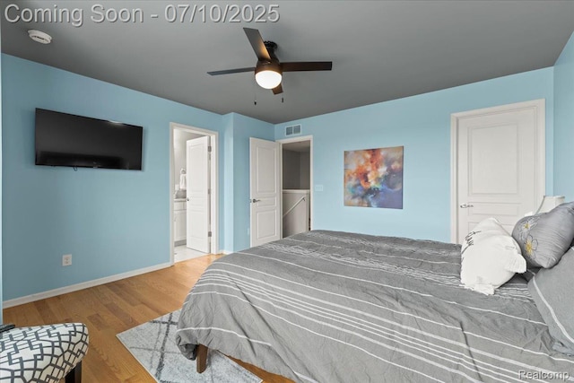 2582 Helmsdale Cir, Rochester, MI 48307 - bedroom with wood finished floors, ensuite bath, and ceiling fan