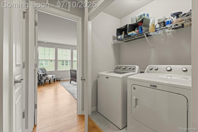 2582 Helmsdale Cir, Rochester, MI 48307 - washroom with separate washer and dryer and light wood finished floors