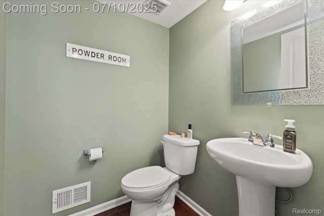 2582 Helmsdale Cir, Rochester, MI 48307 - half bathroom with toilet and wood finished floors