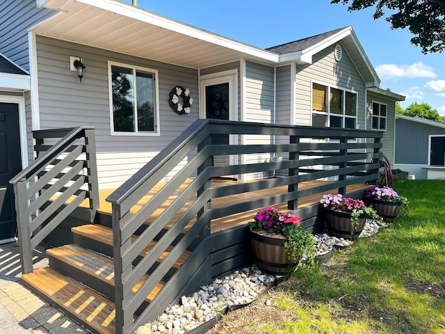 838 Meadow Dr, Traverse City, MI 49685 - view of exterior entry featuring a deck
