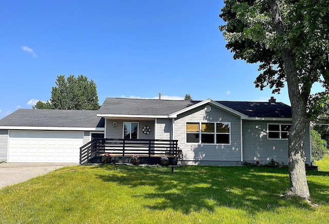 838 Meadow Dr, Traverse City, MI 49685 - view of front facade featuring a front yard, driveway, and a garage
