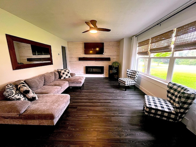 838 Meadow Dr, Traverse City, MI 49685 - living room featuring ceiling fan, a fireplace, and wood finished floors