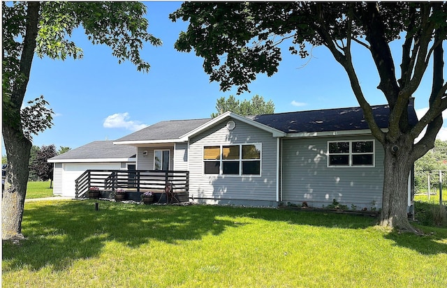 838 Meadow Dr, Traverse City, MI 49685 - single story home with a front yard, a deck, and a garage