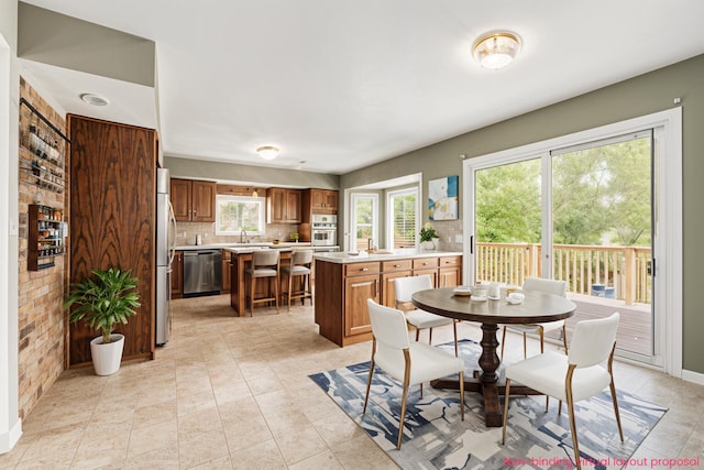 5643 Ivanrest Ave SW, Wyoming, MI 49418 - dining space featuring baseboards