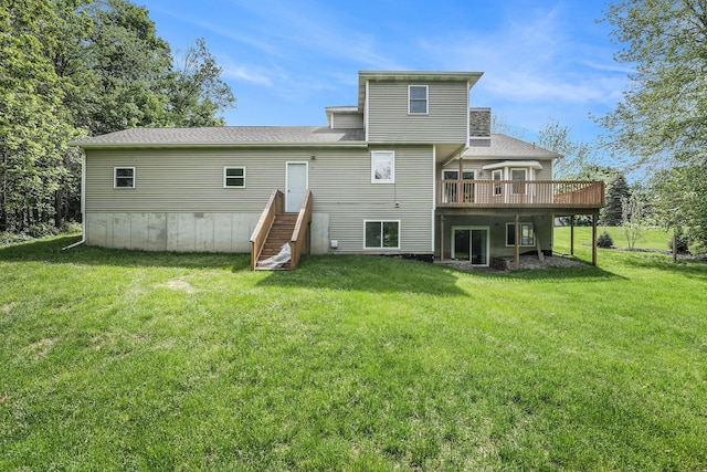 5643 Ivanrest Ave SW, Wyoming, MI 49418 - back of property featuring a wooden deck, a lawn, and a shingled roof