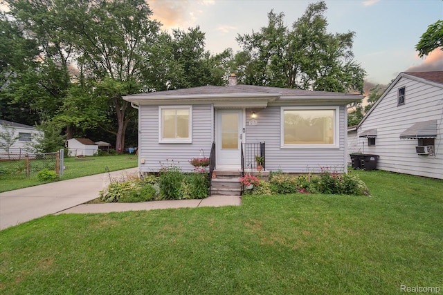 14634 Mcguire St, Taylor, MI 48180 - bungalow-style home with a chimney and concrete driveway