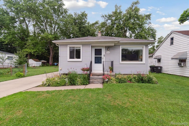 14634 Mcguire St, Taylor, MI 48180 - bungalow-style home with a chimney and concrete driveway