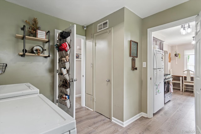 14634 Mcguire St, Taylor, MI 48180 - washroom featuring light wood-type flooring and independent washer and dryer