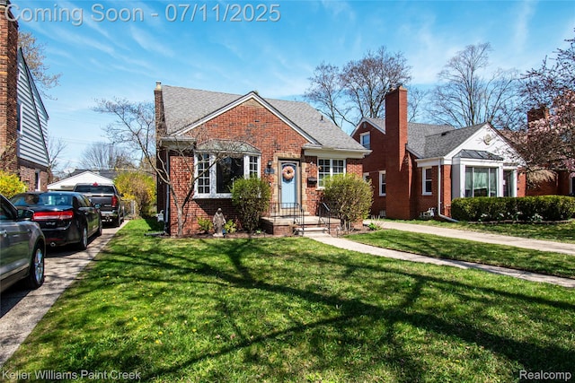 1968 Oxford Rd, Grosse Pointe Woods, MI 48236 - view of front of property with brick siding, a chimney, and a front lawn