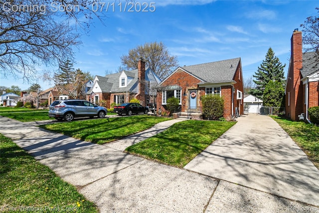 1968 Oxford Rd, Grosse Pointe Woods, MI 48236 - view of front of home featuring brick siding, a front lawn, a residential view, and an outdoor structure