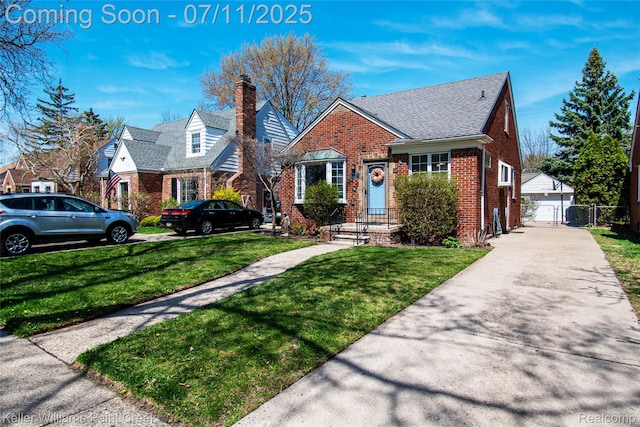 1968 Oxford Rd, Grosse Pointe Woods, MI 48236 - view of front facade with brick siding and a chimney