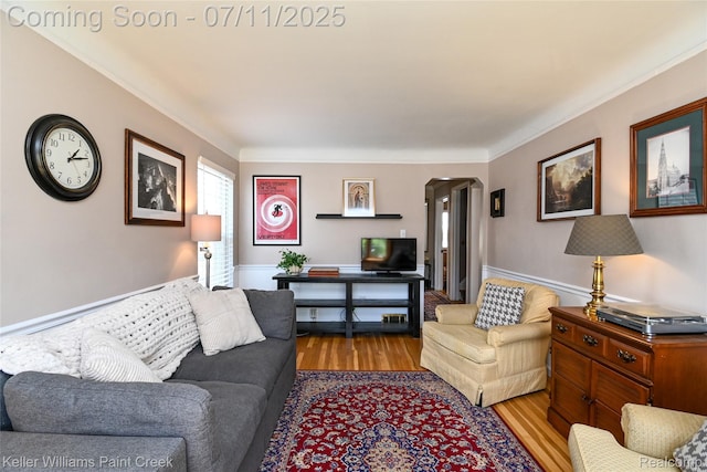 1968 Oxford Rd, Grosse Pointe Woods, MI 48236 - living room with wood finished floors, arched walkways, and crown molding